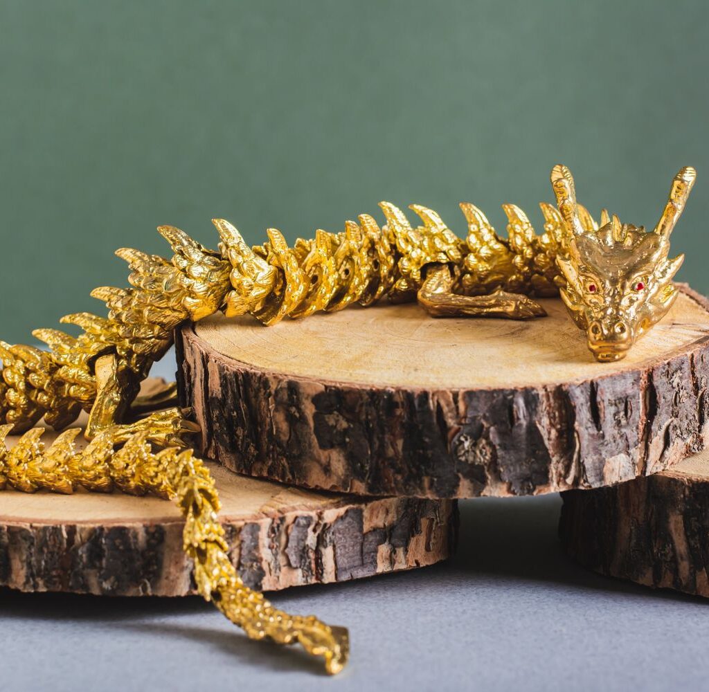 Metal Dragon On Truncks Of Tree On Green Backgroun UPTN5HU 1024x1000