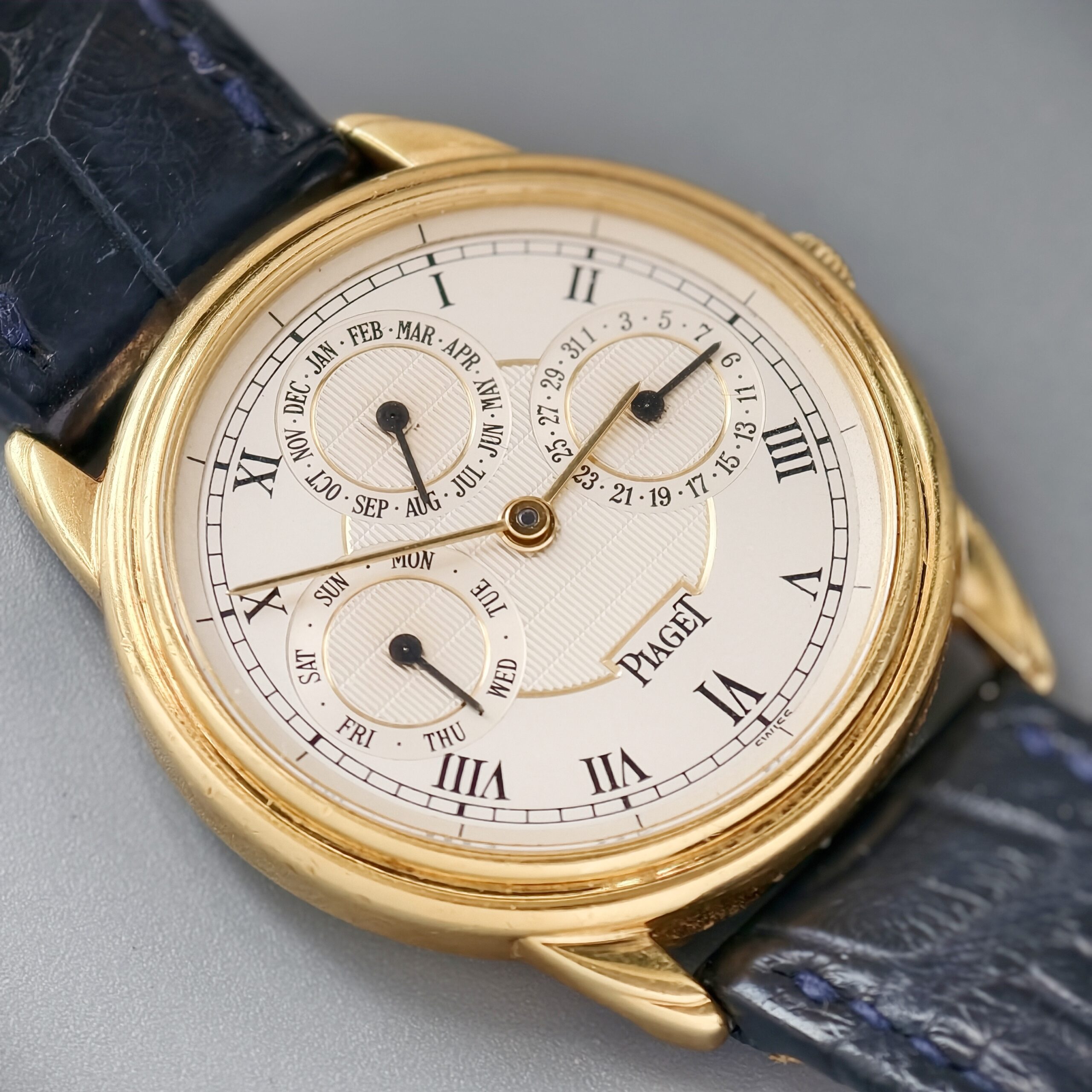 piaget gouverneur ref.15959 18k yellow gold automatic triple calendar watch, guilloché roman dial piaget gouverneur ref.15959 18k yellow gold automatic triple calendar watch, guilloché roman dial